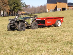 conestoga manure spreaders 50 cu. ft. ground driven spreader towed by atv on horse farm